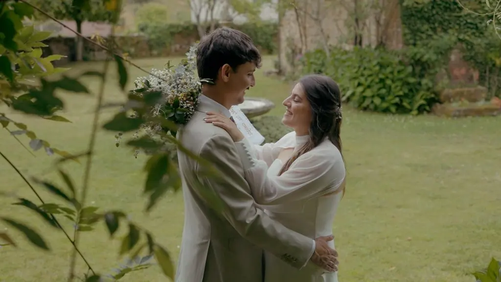 A couple embrace in the garden
